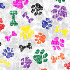 Colorful paw prints and bones pattern on fabric in various hues including green, yellow, orange, pink, purple, black, and blue