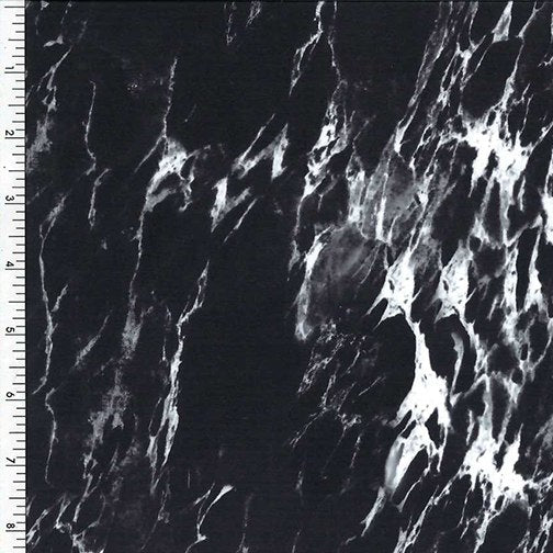 Black and white poly-spandex tricot fabric sample TFX-797 COLOR 09 with measuring ruler, 83% polyester and 17% spandex.